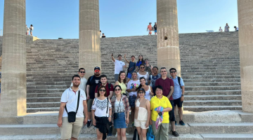 Some of the 2024 Cohort of the Rhodes Academy at the Acropolis in Lindos, Greece.